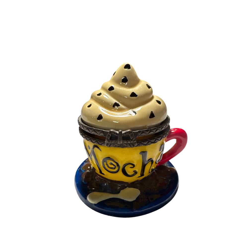 This is a porcelain trinket box shaped like a mocha cup and saucer.